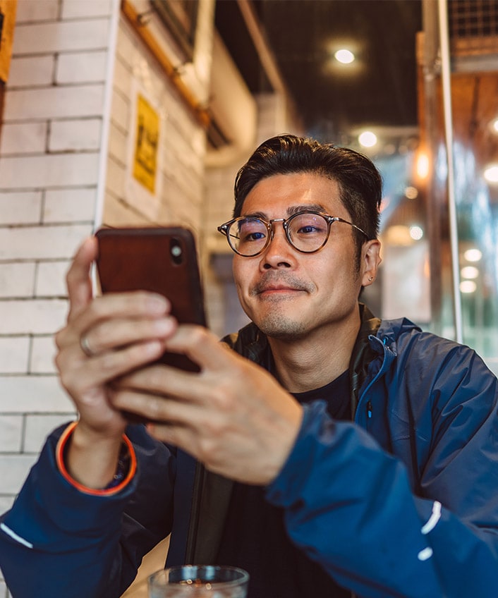 A man staring at his phone